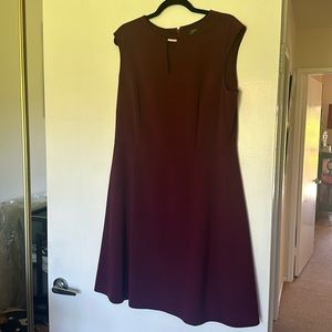 Tahari sleeveless lined wine color dress. Back zip. Neck detail. 14.